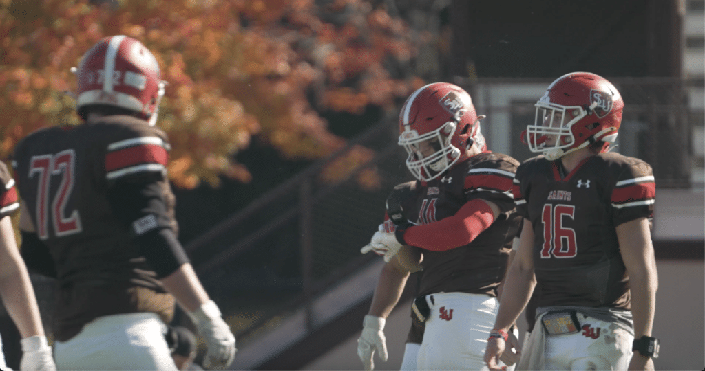 College football team receiving a play call on their wearable GoRout Gridiron devices